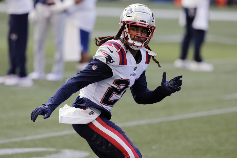 New England Patriots cornerback Stephon Gilmore warms up before an NFL football game against the Seattle Seahawks, Sunday, Sept. 20, 2020, in Seattle. For the second straight week the New England Patriots are heading into a game after having their preparations disrupted by a teammate contracting coronavirus. Last week it was Cam Newton. This week the Patriots' facility was closed for most of the week after reigning Defensive Player of the Year Stephon Gilmore joined Newton on the reserve/COVID-19 list. (AP Photo/John Froschauer, File)