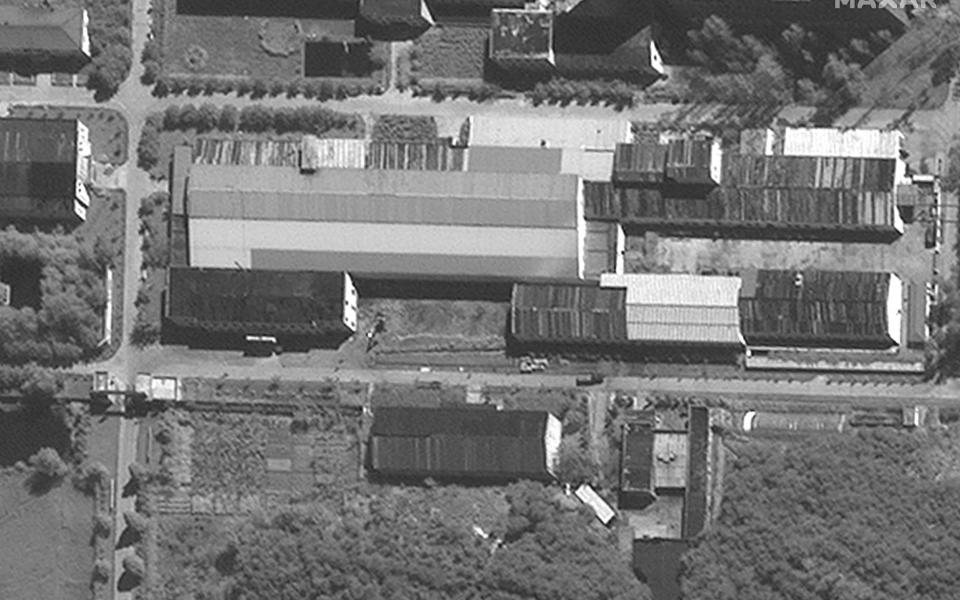 A black and white satellite image shows the facility from above - Maxar Tech/AFP