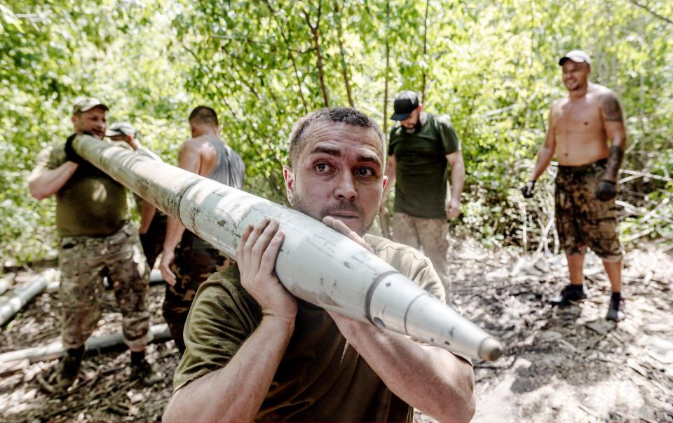 Ukrainian soldiers load grad shells into BM-21 as Ukrainian Army conduct operation to target trenches of Russian forces through the Donetsk Oblast amid Russia and Ukraine war, in the direction of Bakhmut, Donetsk Oblast, Ukraine on August 07, 2023.