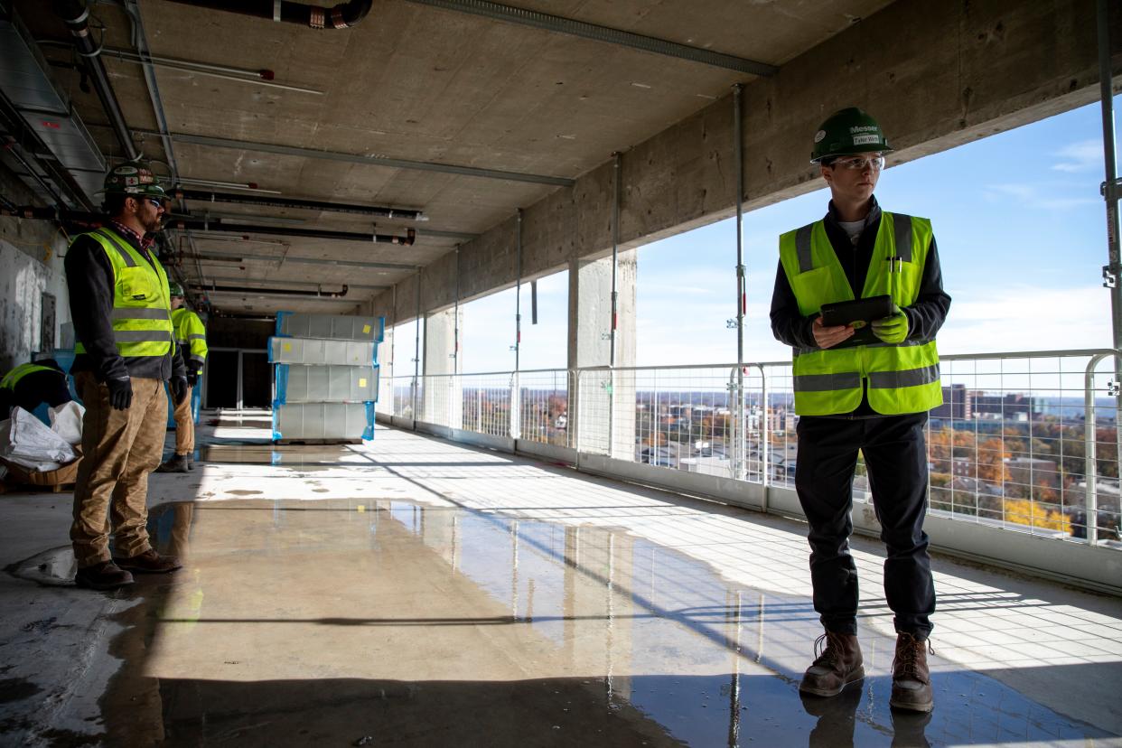 Tyler Wirth, a University of Cincinnati sophomore who works as a project engineer for Messer through the UC cooperative program, makes a safety inspection of a site on the UC campus on Tuesday, Nov. 16, 2021. Wirth is in his second co-op work semester at UC.