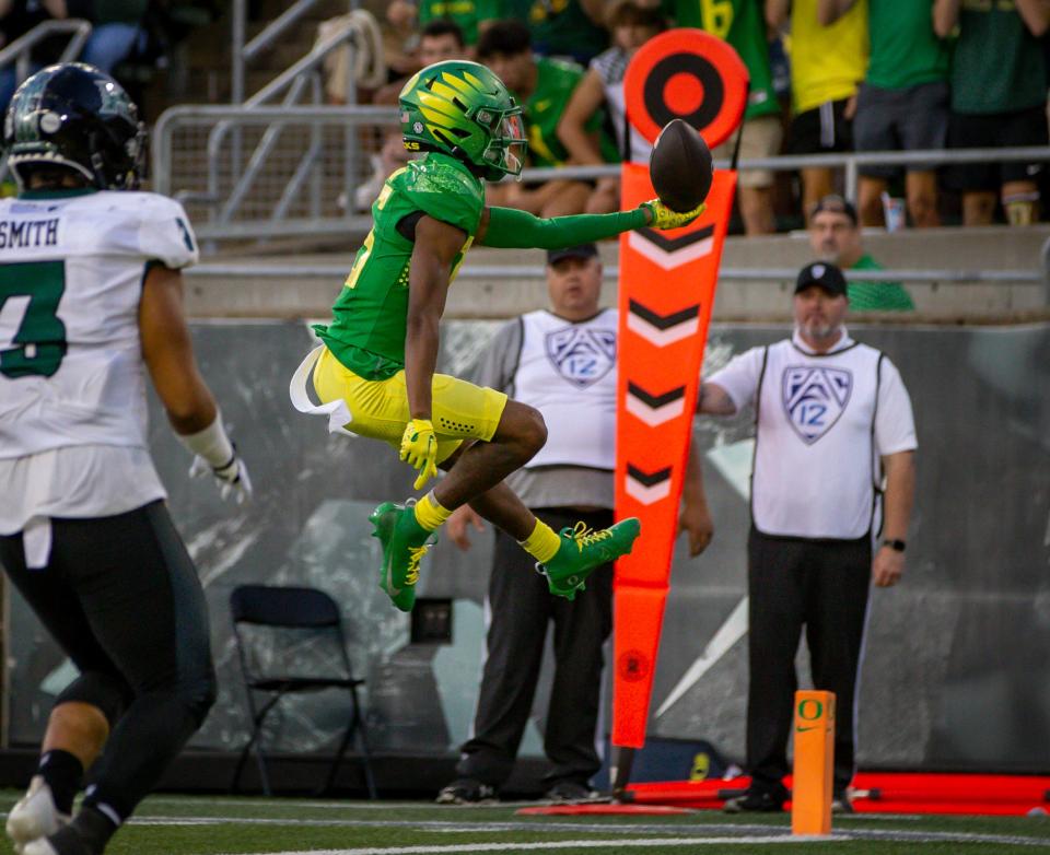 Oregon wide receiver Tez Johnson leaps into the end zone for a touchdown as the Oregon Ducks host Hawaii Saturday, Sept. 16, 2023, at Hayward Field in Eugene, Ore.