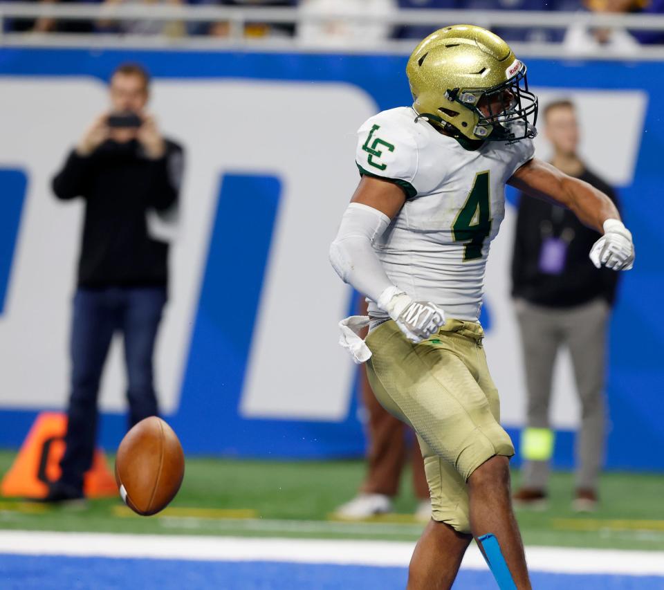 Jackson Lumen Christi's Derrick Walker celebrates scoring a touchdown in the second half of a 15-12 win against Traverse City St. Francis during the MHSAA Division 7 football finals Nov. 26, 2022 at Ford Field in Detroit.