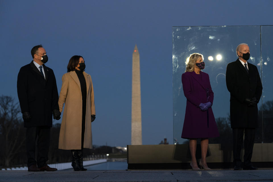 President-elect Joe Biden and his wife Jill Biden are joined by Vice President-elect Kamala Harris and her husband Doug Emhoff during a COVID-19 memorial event at the Lincoln Memorial Reflecting Pool, Tuesday, Jan. 19, 2021, in Washington. (AP Photo/Evan Vucci)