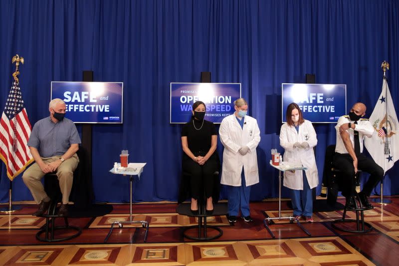 U.S. Vice President Mike Pence, his wife Karen, and U.S. Surgeon General Jerome Adams, sit down to receive the COVID-19 vaccine at the White House in Washington