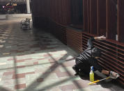 In this May 22, 2020 photo, a maintenance employee cleans some of the woodwork at Foxwoods Resort Casino in Mashantucket, Conn., as part of the casino's stepped up cleaning regimen in advance of a planned partial reopening on June 1. Both the tribal-owned Foxwoods and Mohegan Sun are pushing ahead with plans to open parts of their resorts on tribal lands, despite opposition from Connecticut Gov. Ned Lamont. Foxwoods officials say only 25% of the sprawling resort will be reopened initially. (AP Photo/Susan Haigh)