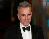 Actor Daniel Day-Lewis poses as he arrives for the British Academy of Film and Arts (BAFTA) awards ceremony at the Royal Opera House in London, Britain, February 10, 2013. REUTERS/Suzanne Plunkett/Files