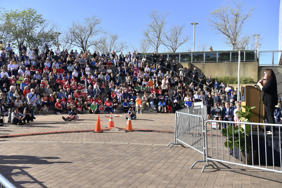 Mourners gather at the Muhammad Ali Center during a vigil for the victims of Monday's shooting in Louisville, Ky., Wednesday, April 12, 2023. (AP Photo/Timothy D. Easley)