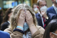 Supporters of the CDU/CSU react after the announcement of the first forecasts on the outcome of the Bundestag elections, at the Konrad Adenauer House, Berlin, Sunday, Sept. 26, 2021. Exit polls show the center-left Social Democrats in a very close race with outgoing Chancellor Angela Merkel’s bloc in Germany’s parliamentary election, which will determine who succeeds the longtime leader after 16 years in power. (Michael Kappeler/dpa via AP)