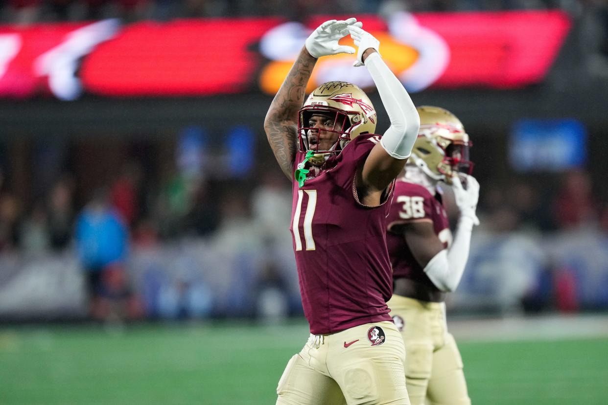 Florida State Seminoles defensive lineman Patrick Payton (11) reacts during the fourth quarter Dec. 2, 2023, against the Louisville Cardinals at Bank of America Stadium in Charlotte, North Carolina. Mandatory Credit: Jim Dedmon-USA TODAY Sports