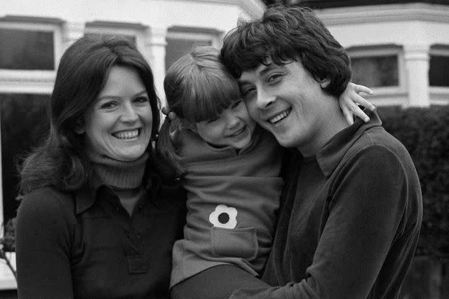 <p>Alamy</p> From L: Judy Loe, Kate Beckinsale and Richard Beckinsale in March 1977