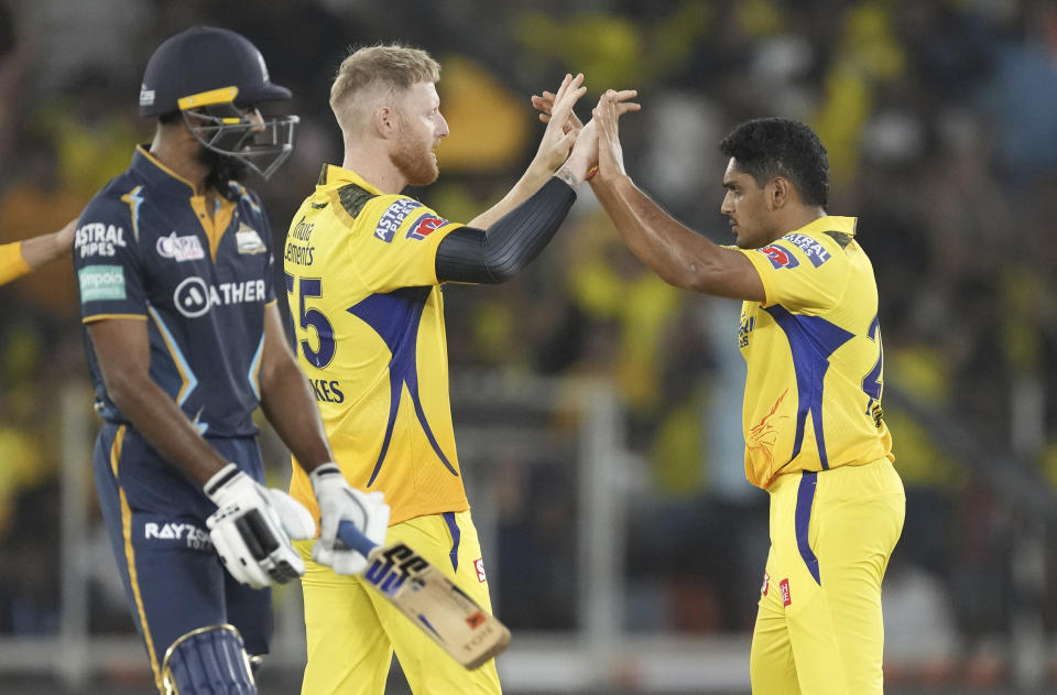 Chennai Super Kings' cricketers celebrate the dismissal of Gujarat Titans' Shubman Gill during the Indian Premier League (IPL) match between Gujarat Titans and Chennai Super Kings in Ahmedabad, India, Friday, March 31, 2023. (AP Photo/Ajit Solanki)