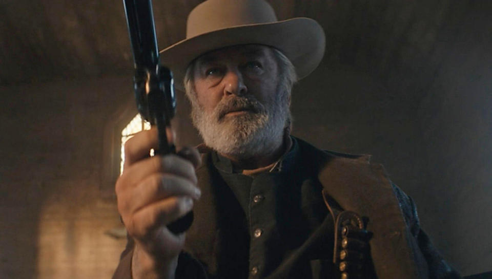 Alec Baldwin practicing a scene with a revolver on the set of the western 