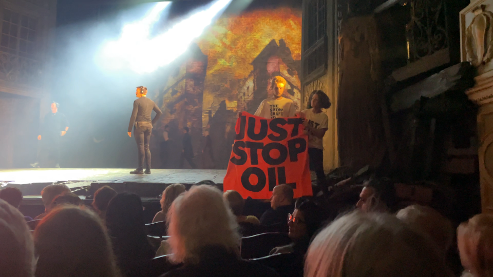 Activists chained themselves to the stage during their protest. (Just Stop Oil)