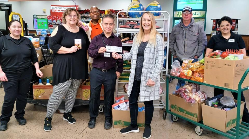 Safeway employees give back. Pictured (from left) is Ruth Garza Linda Perkins of Christlife Ministries, Pastor Jerome Perkins of Christlife Ministries, Robert Padilla, Bernadette Wilkie of Graduated Hope, Kirby Galpin of Christlife Ministries and Danika Pena.