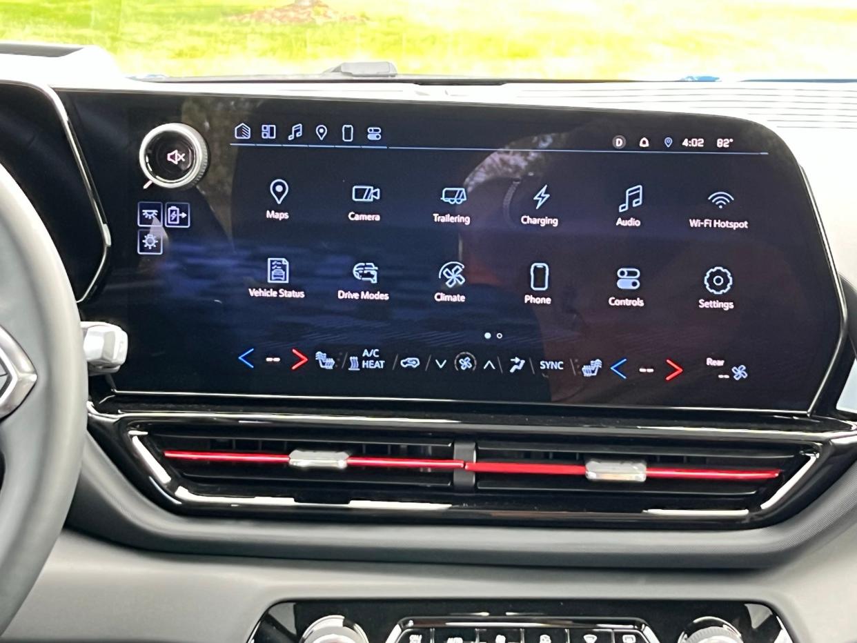 The 2024 Chevrolet Silverado EV RST touch screen showing Android Automotive icons for vehicle and cloud features.