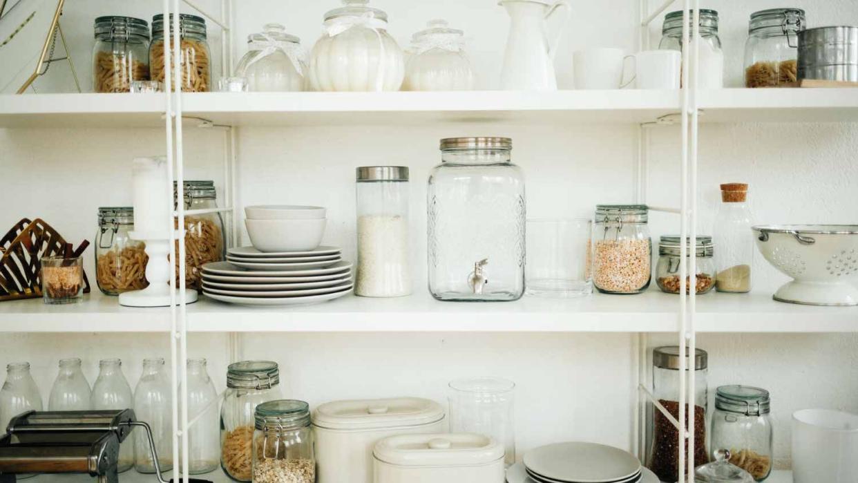 Shelves in the kitchen with dishes and spices