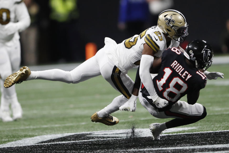 New Orleans Saints cornerback Eli Apple (25) tackles Atlanta Falcons wide receiver Calvin Ridley (18) during the second half of an NFL football game, Thursday, Nov. 28, 2019, in Atlanta. (AP Photo/John Bazemore)