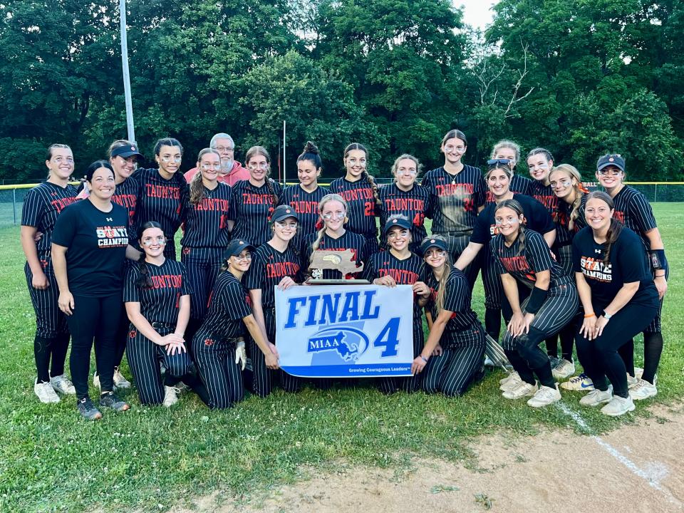 The 2024 Taunton softball team poses with their Division 1 Final Four banner and trophy after beating Methuen in the Elite Eight on June 8, 2024.