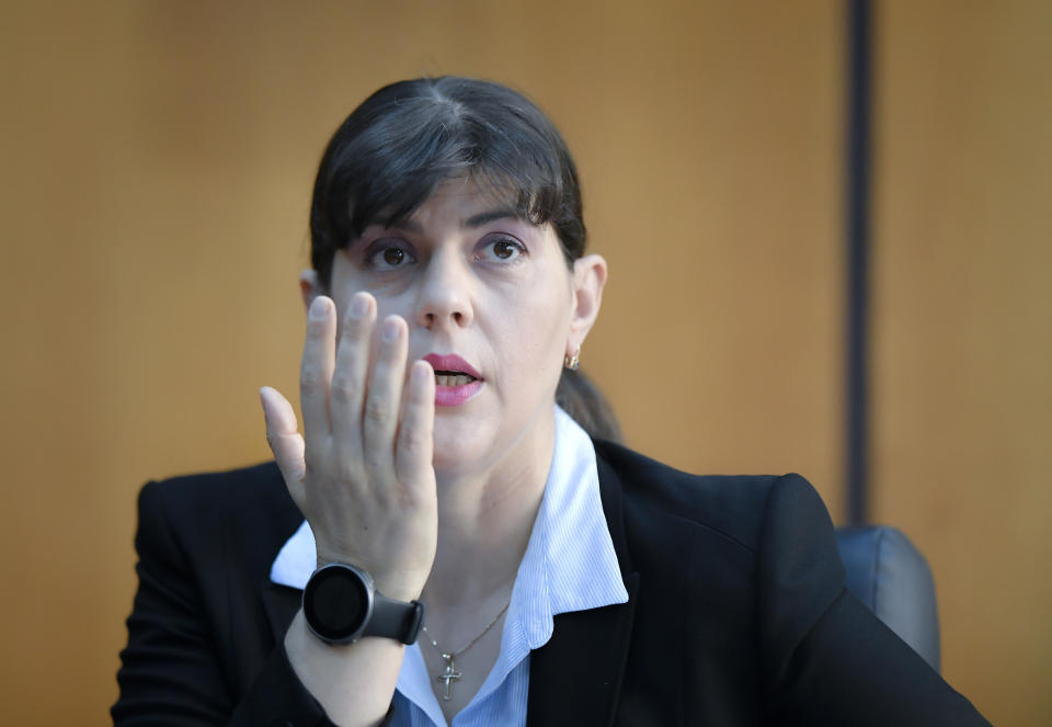 In this photo taken on Friday, Oct. 4, 2019, Laura Codruta Kovesi, Romania's former chief anti-corruption prosecutor who will direct the European Public Prosecutor's Office (EPPO) - tasked with investigating fraud connected to the use of EU funds and other financial crimes, speaks during an interview with the Associated Press, in Bucharest, Romania. For Kovesi, opposition to her successful candidacy to become the European Union’s first chief prosecutor came from a familiar source - her own country’s government. Kovesi spent five years as head of the Romanian Anticorruption Directorate and those indicted by her office included 14 Cabinet members, 53 lawmakers and a member of the European Parliament. (AP Photo/Andreea Alexandru)