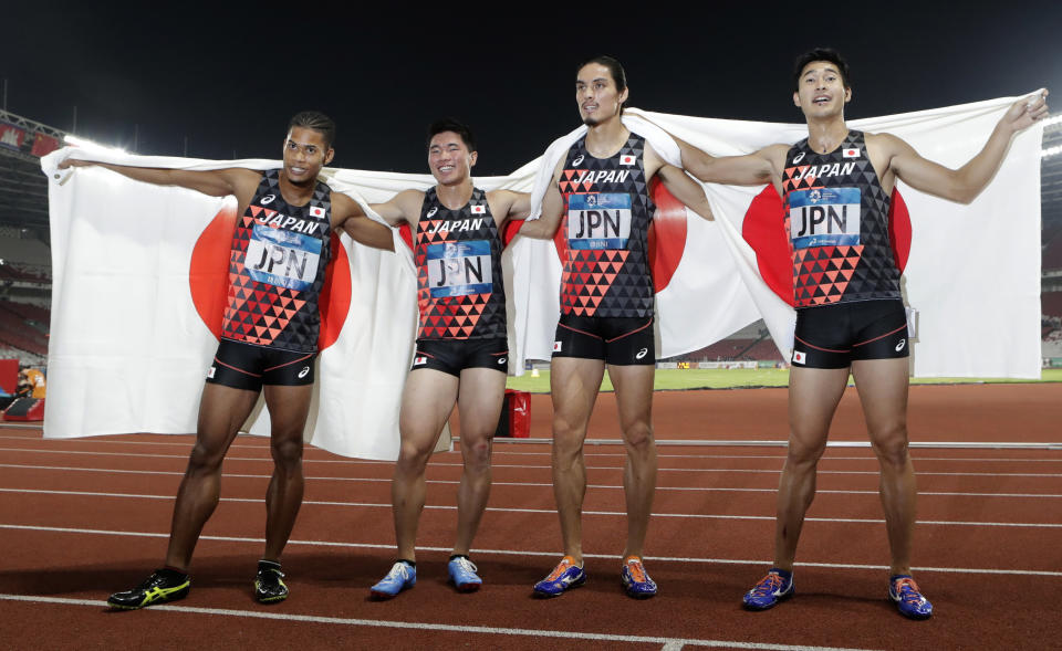 Japan's men's 4x400m relay team celebrate after their third place finish during the athletics competition at the 18th Asian Games in Jakarta, Indonesia, Thursday, Aug. 30, 2018. (AP Photo/Lee Jin-man)