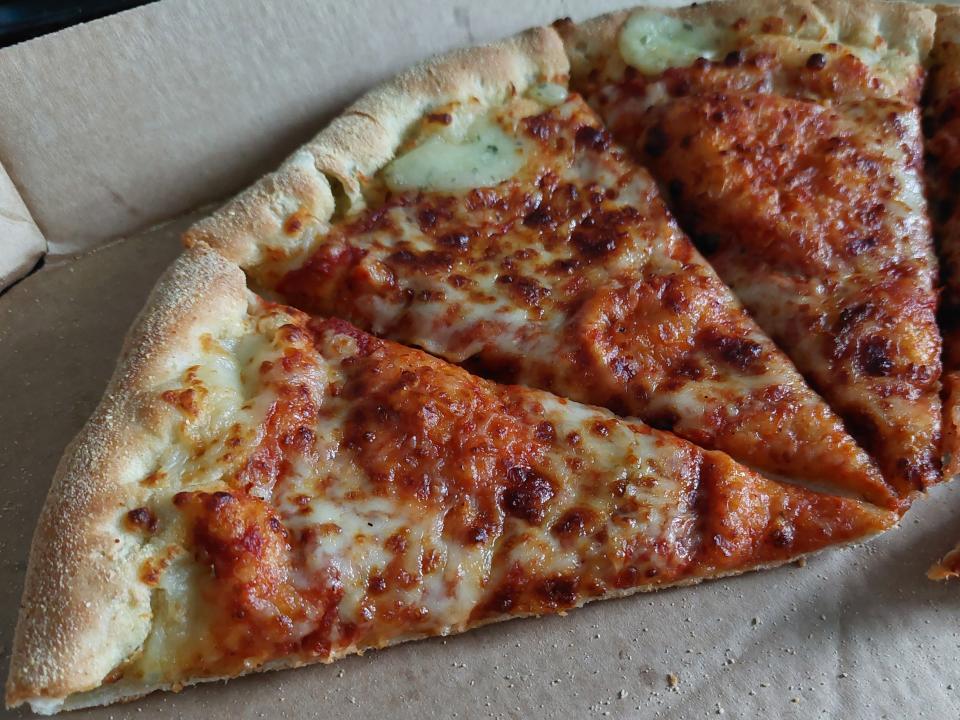 Slices of pizza from Domino's, displayed in a box