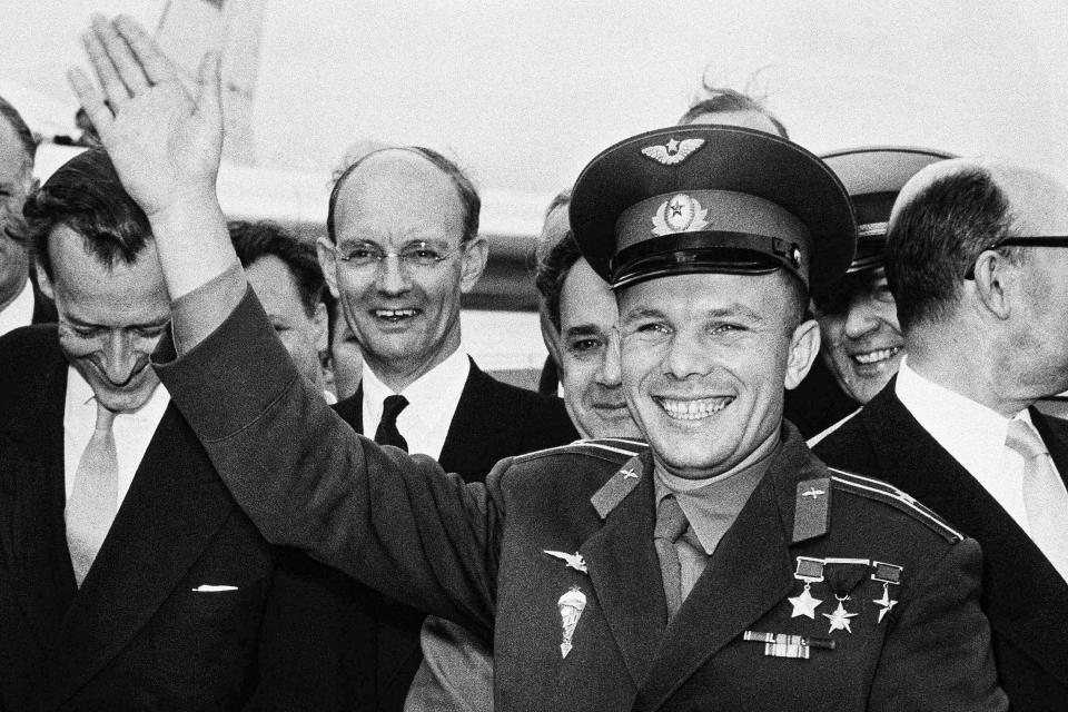 FILE - Soviet spaceman Yuri Gagarin waves after arriving at the London Airport, for a private visit as the guest of the Russian Trade fair, July 11, 1961. The successful one-orbit flight on April 12, 1961 made the 27-year-old Gagarin a national hero and cemented Soviet supremacy in space until the United States put a man on the moon more than eight years later. (AP Photo/File)