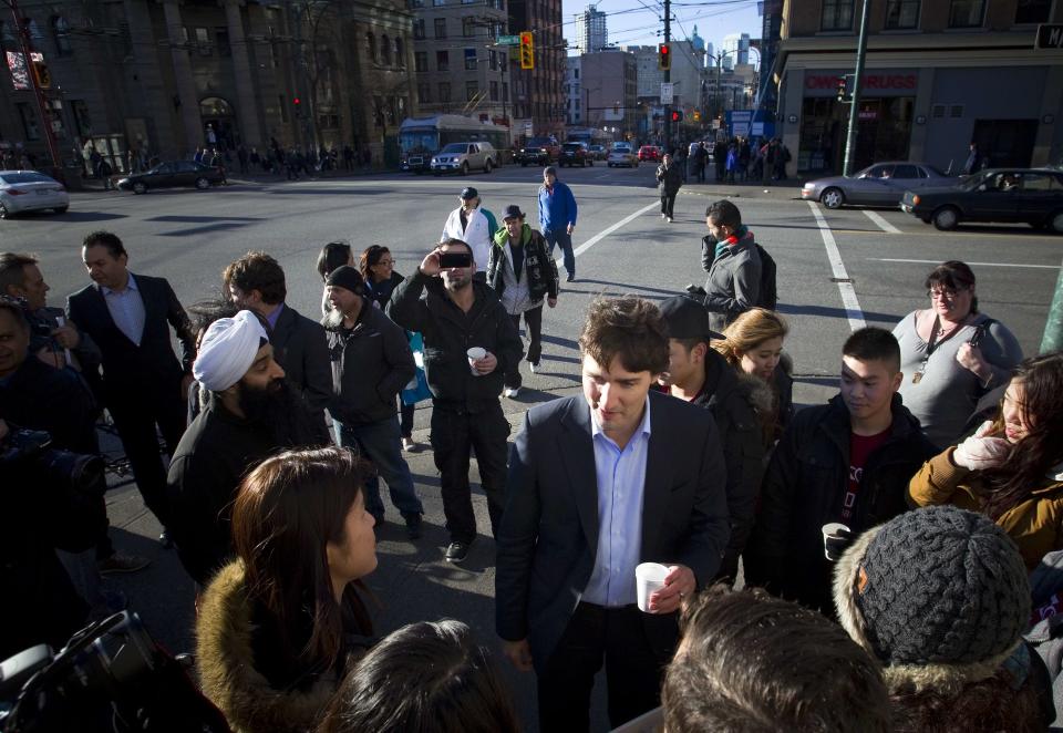 Leader of the Liberal Party of Canada, MP Justin Trudeau walks across Hastings Street in the downtown eastside neighbourhood in Vancouver.