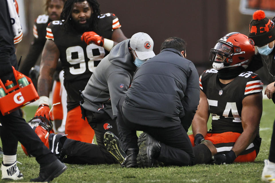 Cleveland Browns defensive end Olivier Vernon (54) grimaces after an injury during the second half of an NFL football game against the Pittsburgh Steelers, Sunday, Jan. 3, 2021, in Cleveland. (AP Photo/Ron Schwane)