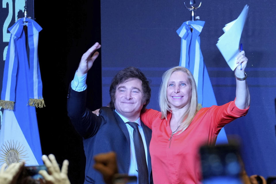 Javier Milei, presidential candidate of the Liberty Advances coalition, right, celebrates with his sister Karina Milei after being elected president in a runoff election in Buenos Aires, Argentina, Sunday, Nov. 19, 2023. (AP Photo/Natacha Pisarenko)