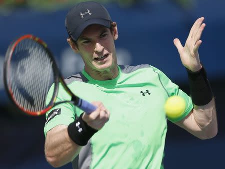 Andy Murray of Britain returns the ball to Joao Sousa of Portugal during their match at the ATP Championships tennis tournament in Dubai, February 25, 2015. REUTERS/Ahmed Jadallah