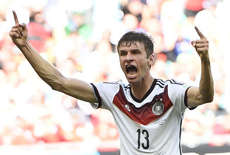 Germany's Thomas Mueller celebrates scoring his team's third goal, his second goal for the match, against Portugal during their 2014 World Cup Group G soccer match at the Fonte Nova arena in Salvador, June 16, 2014. REUTERS/Dylan Martinez