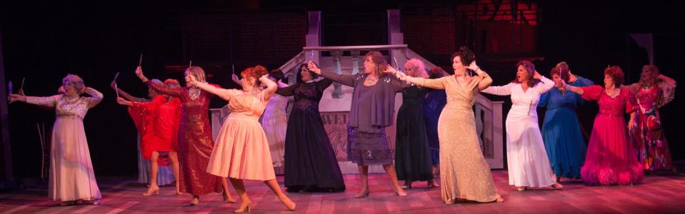 A group of former showgirls recreates one of their old dance routines in a scene from Stephen Sondheim’s “Follies” at the Players Centre for Performing Arts in 2019.