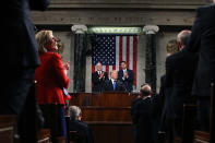 <p>Trump, center, pauses while delivering his first State of the Union address to a joint session of Congress at the U.S. Capitol in Washington, D.C., on Jan. 30. (Photo: Win McNamee/Pool via Bloomberg) </p>