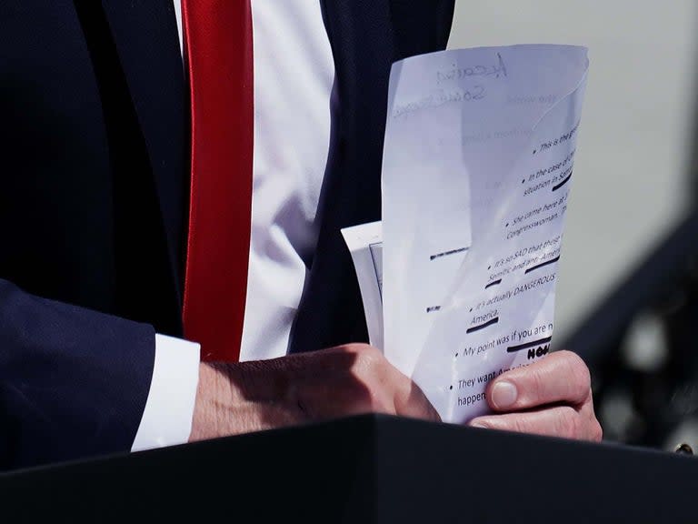 Donald Trump inadvertently exhibited his handwritten notes during a speech, revealing how he planned to attack four Democratic congresswomen – as well as a glaring spelling error which has been ridiculed online.The US president brandished a piece of paper with a list of prompts during his latest racist rant outside the White House on Monday.Pictures taken by Washington Post photographer Jabin Botsford showed a scribbled note about “Alcaida”, seemingly a phonetic misspelling of Al-Qaeda.The note was an apparent reminder to Mr Trump to smear Democratic congresswoman Ilhan Omar, who the president falsely accused during his speech of praising the Islamist terror group.Ms Omar, the Minnesota representative, is one of four Democratic women of colour who have been repeatedly targeted by Mr Trump in recent days. > @realDonaldTrump notes today on @AOC and @IlhanMN flipped and rotated for your viewing pleasure. pic.twitter.com/42sdbsRivQ> > — Jabin Botsford (@jabinbotsford) > > July 15, 2019In his address on Monday, he doubled down on his racist attacks and suggested the congresswomen should “leave right now” instead of “complaining” about the US.He had previously said: “Why don’t they go back and help fix the totally broken and crime infested places from which they came.” All four are American citizens and three were born in the US.Mr Trump’s notes, which were mostly typed out and printed, also reminded him to state “this is the greatest country in the world” and that “in the case Ohmar [sic] we saved her from a dangerous situation in Somalia”.“She came here at 10 years old and is now a Congresswoman. That would ONLY happen in America,” they add. “It’s so SAD that these women have a record of saying anti-Semitic and anti-American things all the name,” another prompt read. “It’s actually DANGEROUS – because it seems like they hate America.”Another handwritten note said “some people”, while another appeared to say “Hollywood people”.But it was Mr Trump’s erroneous spelling of the name of one of the world’s most well-known terror groups which attracted attention on social media.“Only a person who hasn’t read any newspaper articles or briefing papers in the last 20 years would not know how to spell Al Qaeda,” tweeted journalist Helen Kennedy.Nada Bakos, a former CIA anaylst, said: “How you know Potus doesn’t read anything the experts provide.”