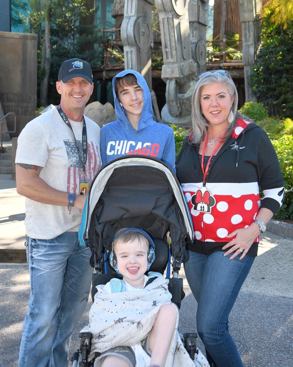 The Taylor family of Tampa, Fla. - Mike, Chase and Jocelyn, back, and 7-year-old Raylan, who has Joubert syndrome - at Hollywood Studios.