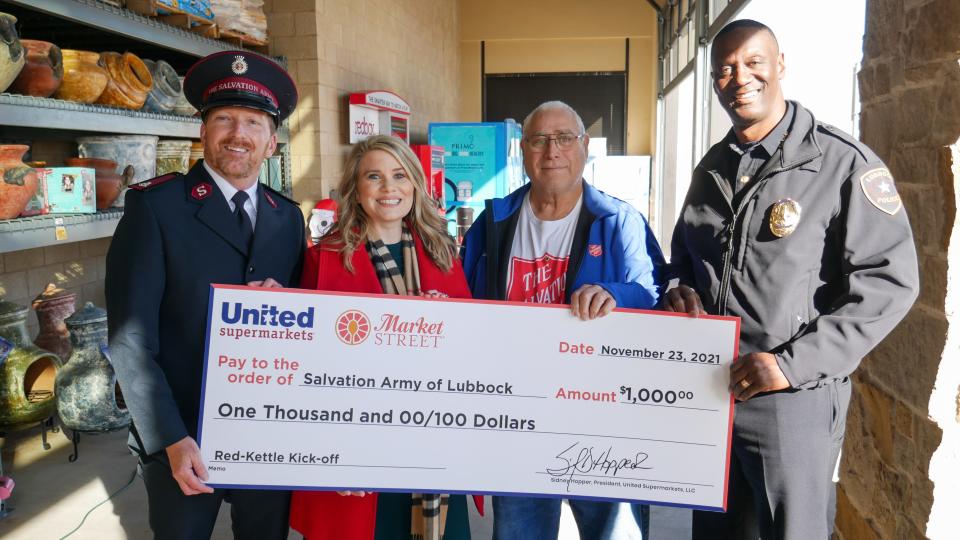 Lubbock Police Chief Floyd Mitchell, right, joined organizers and volunteers with the United Family and the Salvation Army to kick off the non-profit organization's Red Kettle fundraiser.