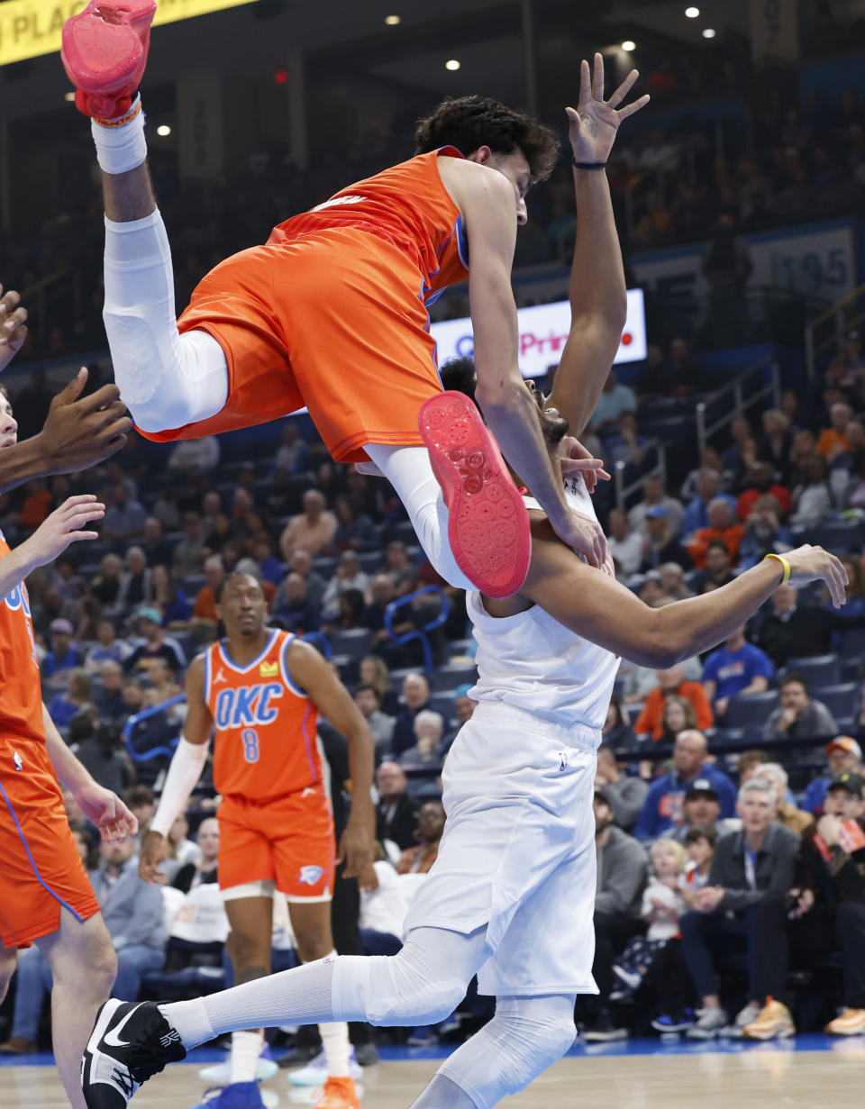 Nov 8, 2023; Oklahoma City, Oklahoma, USA; Oklahoma City Thunder forward Chet Holmgren (7) flys over Cleveland Cavaliers center Jarrett Allen (31) during the first quarter at Paycom Center. Mandatory Credit: Alonzo Adams-USA TODAY Sports