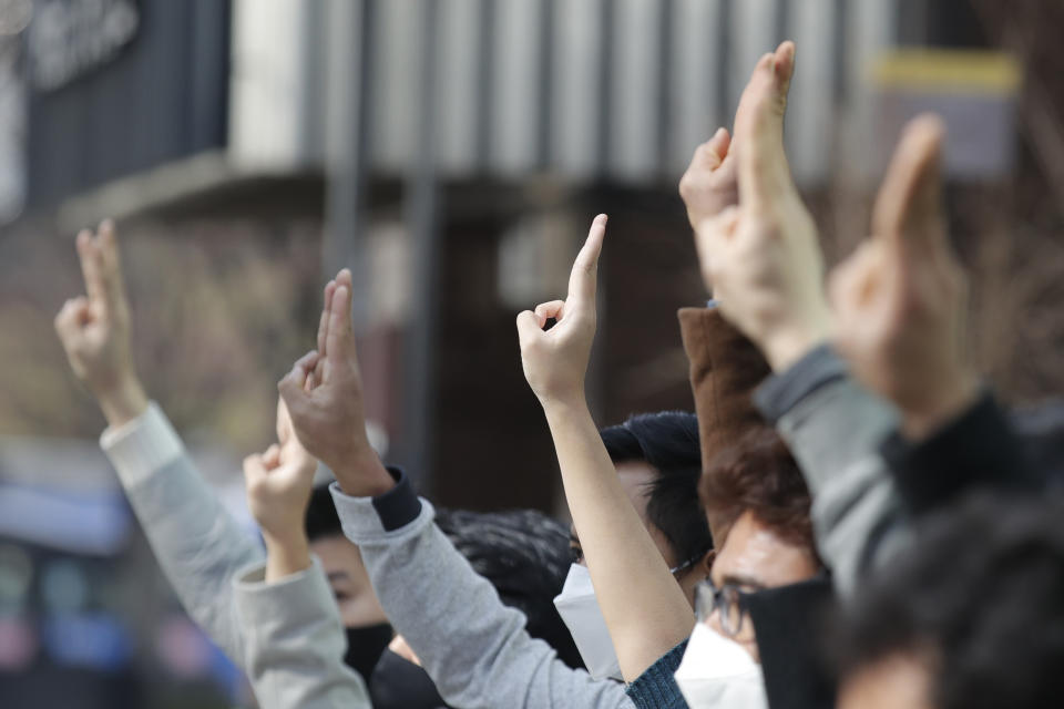 Youths from Asian countries participate during a press conference supporting Myanmar's democracy outside of the Office of the United Nations High Commissioner for Human Rights, in Seoul, South Korea, Sunday, Feb. 21, 2021. (AP Photo/Lee Jin-man)