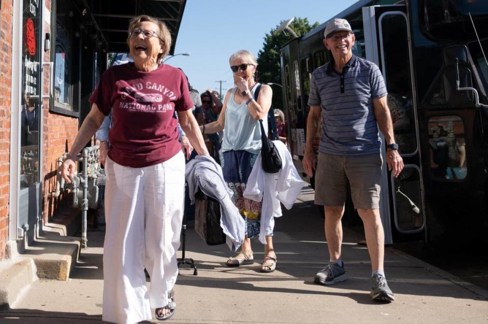 From left, Donna Myers, Linda Medoff and Richard Milford exit the Red Machine Party Bus at Tarahumaras Mexican Food, the first stop on the inaugural KCK Taco Trail Tour.