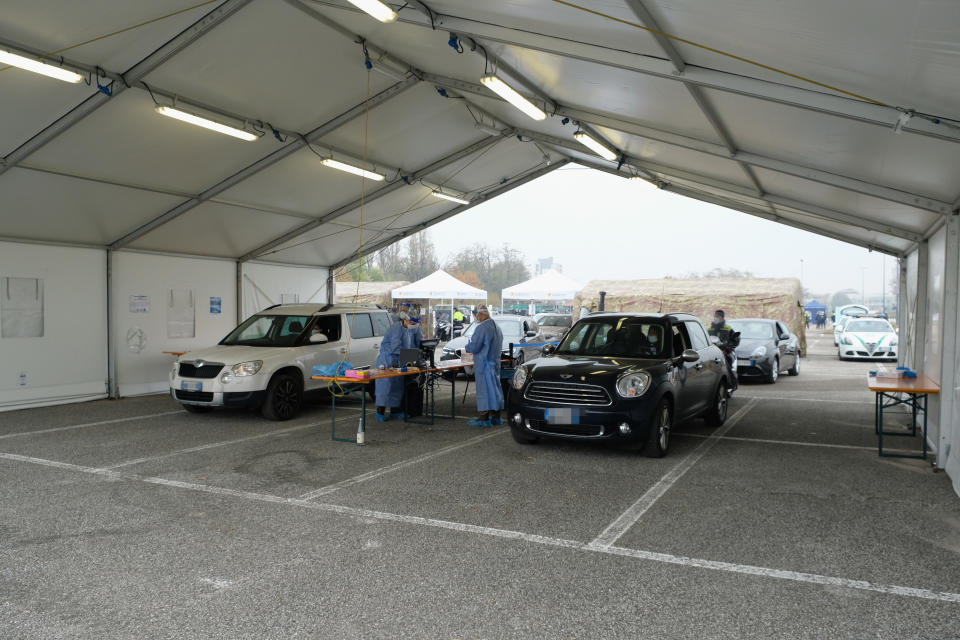 MILAN, ITALY - NOVEMBER 13:  Members of the public in cars queue for a swab test on November 13, 2020 in Milan, Italy. Today in the parking near via Novara, the largest drive-through for covid 19 in Italy went into operation to perform rapid antigen swab tests. The structure was built with collaboration between ATS (Health Protection Agency) metropolitan city of Milan, municipality of Milan, Army Italian, Civil Protection and Asst (Territorial Social Healthcare Companies) Santi Paolo e Carlo.  (Photo by Pier Marco Tacca/Getty Images)