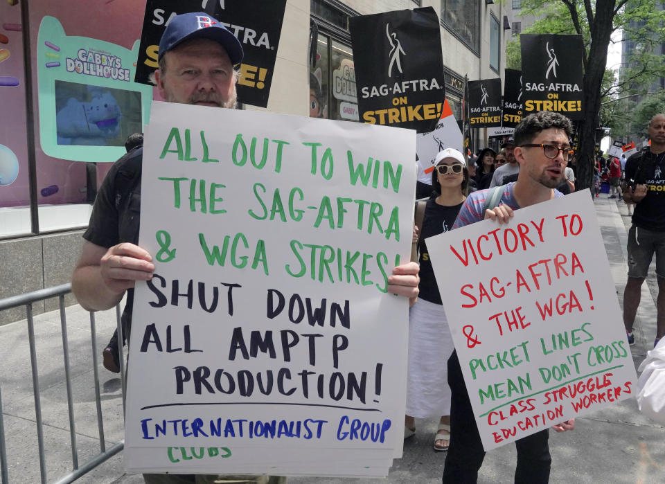 CORRECTS YEAR TO 2023, NOT 2003 - Writers and actors join forces as they walk the picket line during a strike, Friday, July 14, 2023, at NBC Universal Studios in New York. The picketing comes a day after the main actors’ union voted to join screenwriters in a double-barreled strike for the first time in more than six decades. The dispute immediately shut down production across the entertainment industry after talks for a new contract with studios and streaming services broke down. (AP Photo/Bebeto Matthews)