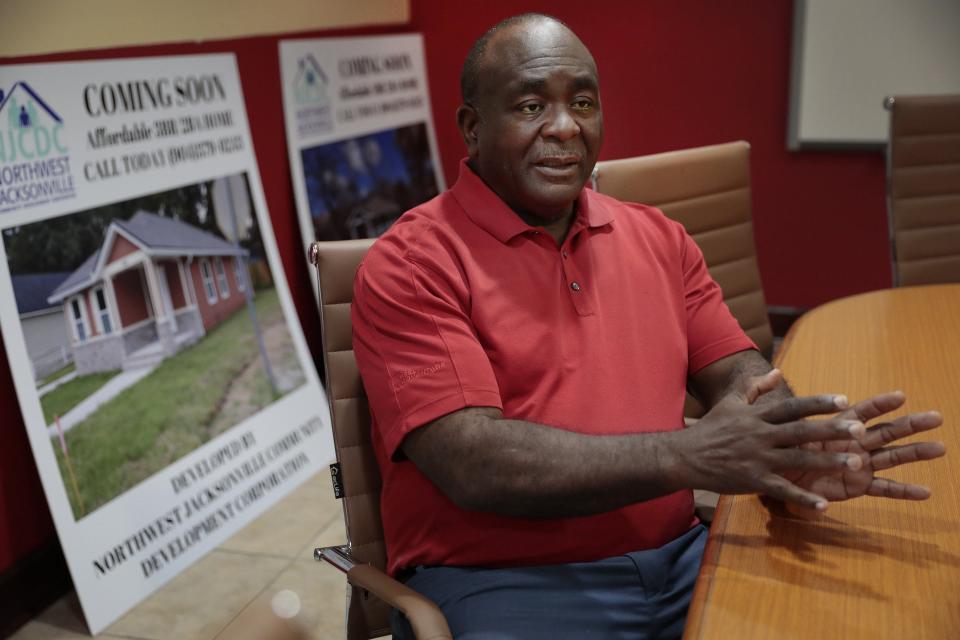 Paul Tutwiler, executive director of the Northwest Jacksonville Community Development Corporation, speaks at his Myrtle Avenue office Jan. 12. His organization purchases homes, fixes them up and rents them to families that can't afford market-rate rent.