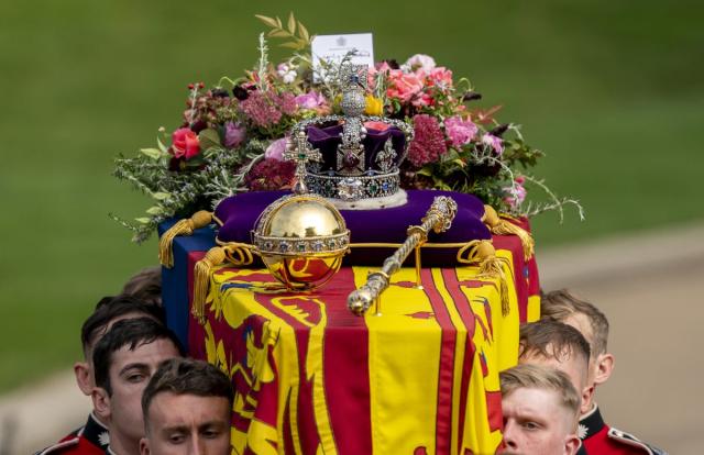 The coffin of the Queen, draped in the Royal Standard with the Imperial State Crown and the Sovereign’s orb and sceptre (PA) (PA Wire)