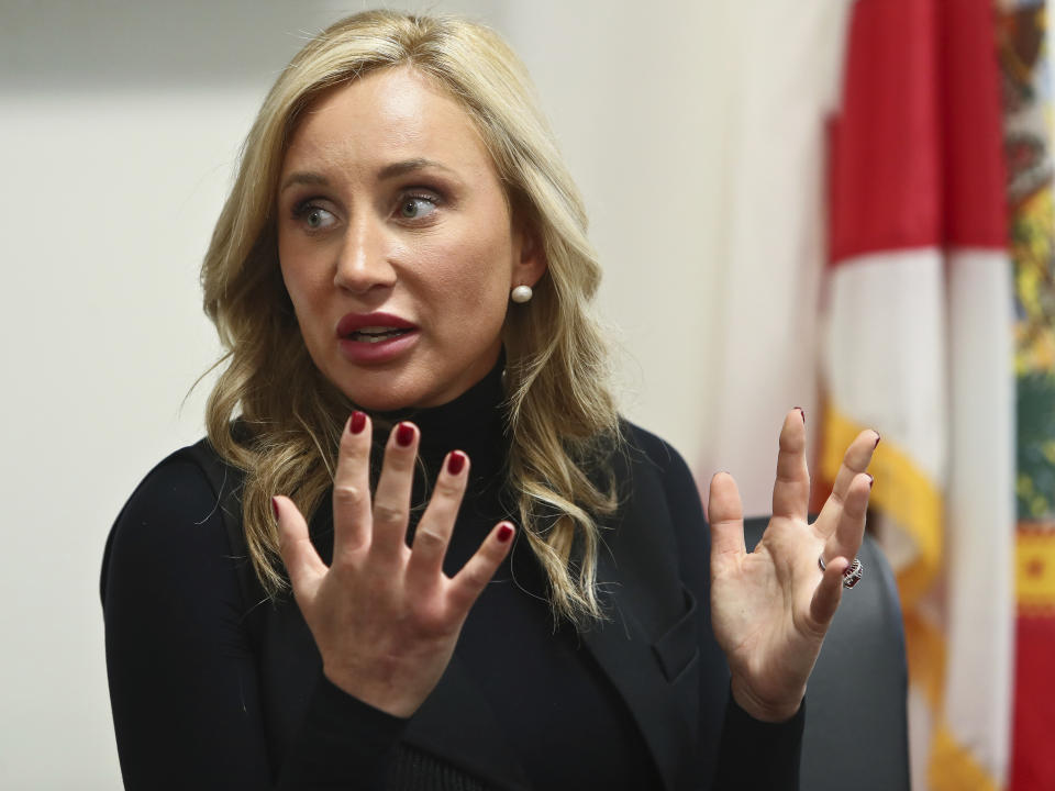 Sen. Lauren Book, D-Plantation gestures as she speaks to the media Monday, Feb. 6, 2023 in the Senate Office Building at the Capitol in Tallahassee, Fla. Florida legislators are meeting in a two-week special session to take up a list of issues proposed by Gov. Ron DeSantis. (AP Photo/Phil Sears)