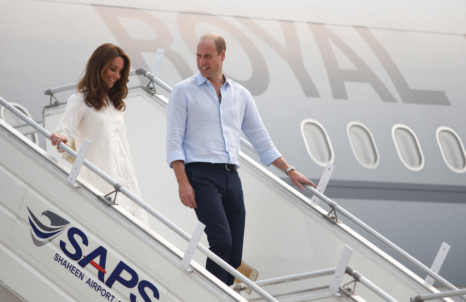 The Duke and Duchess of Cambridge walk down the steps of an RAF Voyager aircraft as they arrive in Lahore, at the start of the fourth of the royal visit to Pakistan. Later, the plane was forced to turn back after two aborted landings due to a thunderstorm. Source: Peter Nicholls/PA Wire