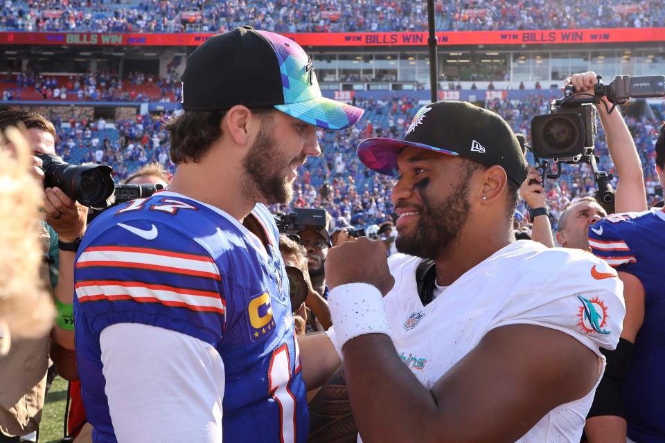 Buffalo Bills quarterback Josh Allen, left, greets Miami Dolphins quarterback Tua Tagovailoa, right, following an NFL football game, Sunday, Oct. 1, 2023, in Orchard Park, N.Y. (AP Photo/Jeffrey T. Barnes)