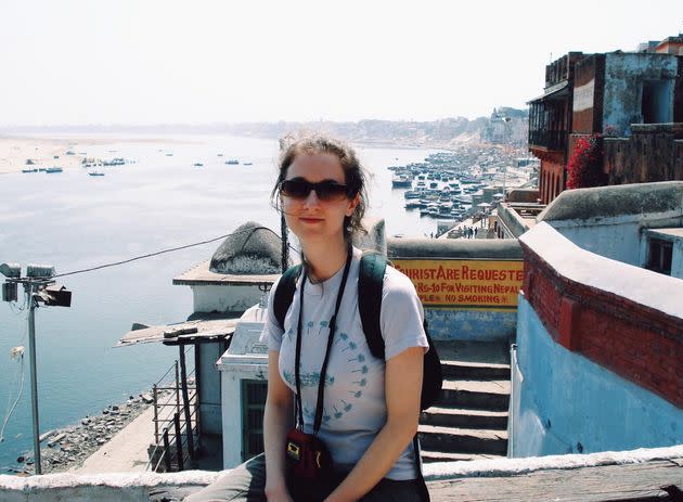 The author in front of the Ganges River in Varanasi, India, in 2008, nearly a year after the 