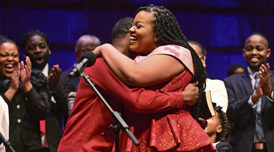 St. Paul Councilwoman Cheniqua Johnson hugs Nathan Annan after her oath of office during the inauguration ceremony for St. Paul City Council members in St. Paul, Minn. on Tuesday, Jan. 9, 2024. The youngest and most diverse city council in the history of Minnesota's capital city was sworn into office Tuesday, officially elevating the first all-female St. Paul City Council into public service at City Hall. (John Autey /Pioneer Press via AP)