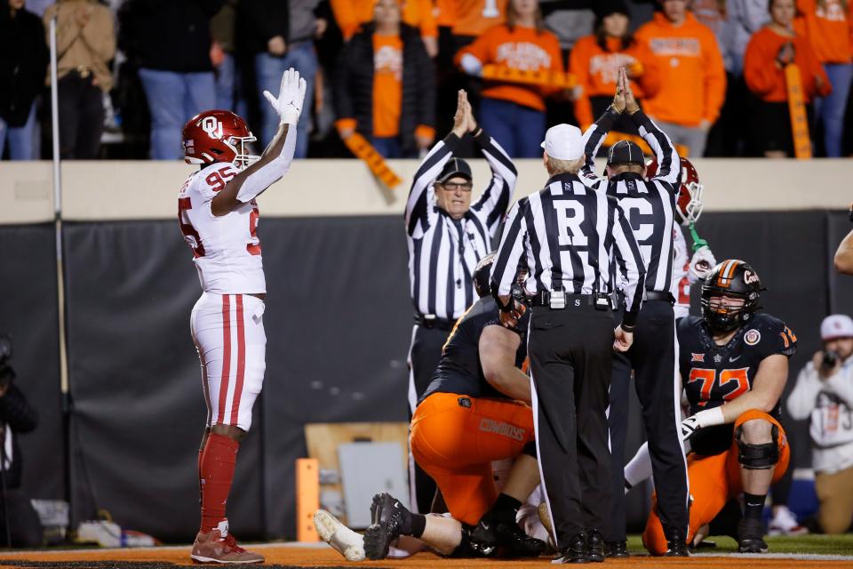 Oklahoma's Isaiah Thomas (95) celebrates a safety during a Bedlam college football game between the Oklahoma State University Cowboys (OSU) and the University of Oklahoma Sooners (OU) at Boone Pickens Stadium in Stillwater, Okla., Saturday, Nov. 27, 2021. Oklahoma State won 37-33. 