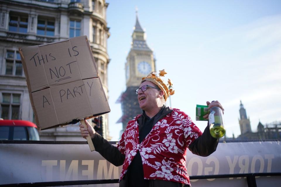 A protestor in Parliament Square amid public anger over lockdown parties (Dominic Lipinski/PA) (PA Wire)